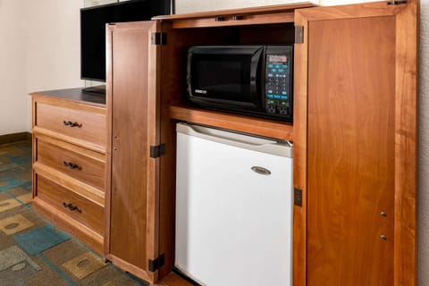 Premium bedding, desk, laptop workspace, iron/ironing board