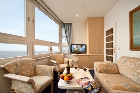 Suite, Balcony, Partial Sea View | Living room | Flat-screen TV
