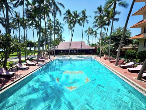 Outdoor pool, open 7:00 AM to 9:00 PM, pool umbrellas, sun loungers