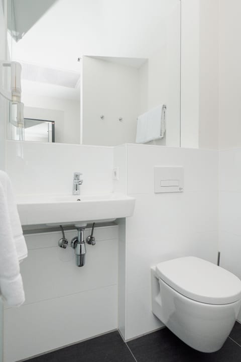 Shower, eco-friendly toiletries, towels, soap