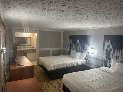 Standard Room, 2 Queen Beds, Non Smoking, Jetted Tub | Desk, blackout drapes, soundproofing, iron/ironing board