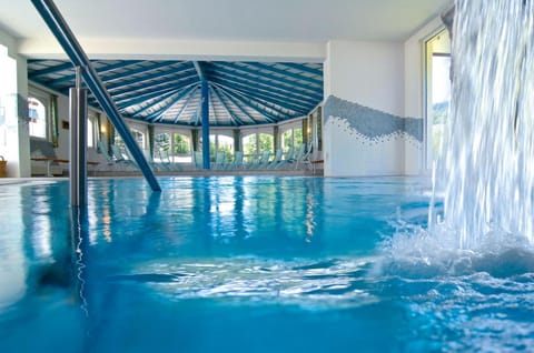 Indoor pool, seasonal outdoor pool, pool umbrellas, sun loungers