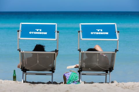 Beach nearby, white sand, sun loungers, beach umbrellas