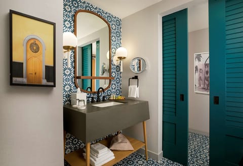 Shower, designer toiletries, hair dryer, bathrobes