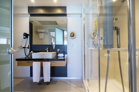 Shower, free toiletries, hair dryer, slippers