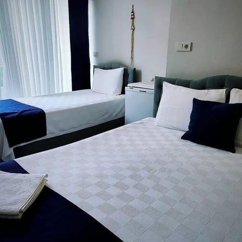 Triple Room | Iron/ironing board, free WiFi, bed sheets