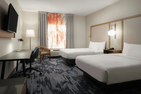 Pillowtop beds, desk, blackout drapes, iron/ironing board