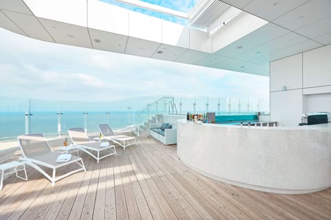 Outdoor pool, sun loungers, lifeguards on site