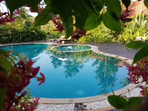 Outdoor pool, open 7:30 AM to 9:00 PM, pool umbrellas