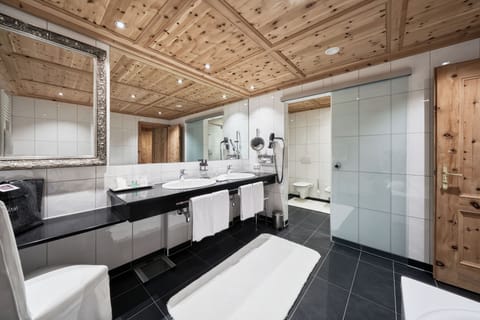 Designer toiletries, hair dryer, bathrobes, slippers