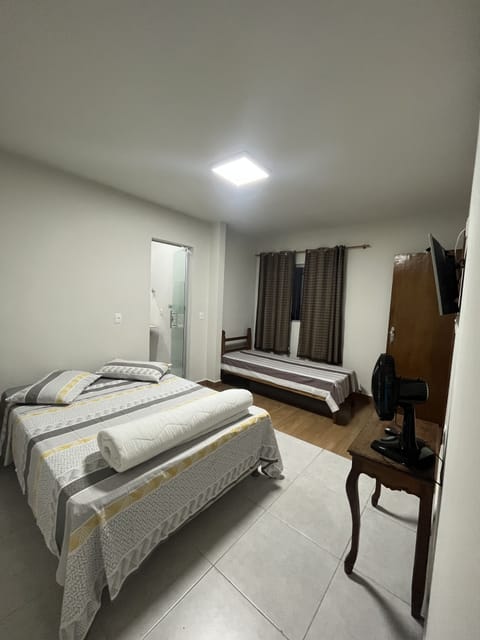 Family Room | Minibar, desk, blackout drapes, iron/ironing board