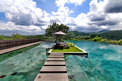 Outdoor pool, open 7:00 AM to 7:00 PM, pool umbrellas