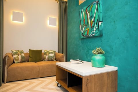 Premium Double Room, Patio (EMERALD) | Living area | LCD TV