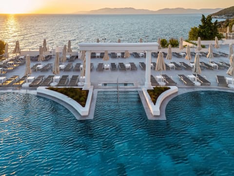 Indoor pool, outdoor pool, pool umbrellas, sun loungers