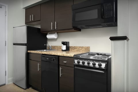 Suite, 1 Bedroom | Private kitchen | Fridge, microwave, stovetop, dishwasher
