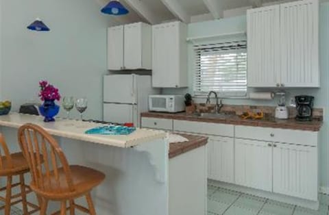 Fridge, microwave, cookware/dishes/utensils