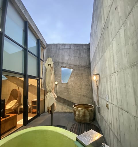 Grand Double Room, Patio, Mezzanine | Bathroom | Spring water tub, free toiletries, hair dryer, bathrobes