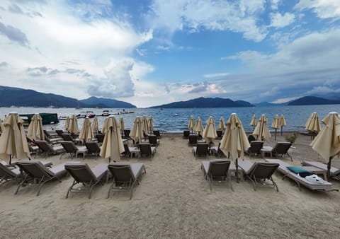 Private beach nearby, sun loungers, beach umbrellas