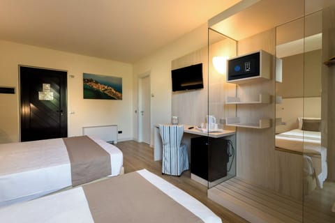 Superior Triple Room | Minibar, in-room safe, desk, soundproofing