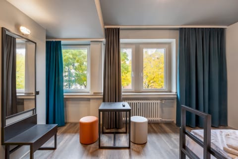 Twin Room | Desk, blackout drapes, iron/ironing board, free WiFi