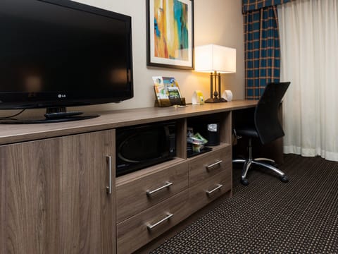 Premium bedding, pillowtop beds, laptop workspace, blackout drapes