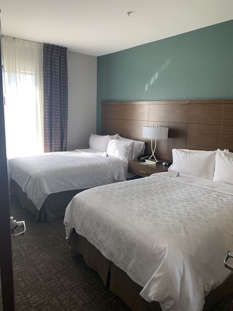 Desk, laptop workspace, blackout drapes, iron/ironing board