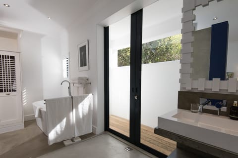 Luxury Suite, Poolside | Bathroom | Separate tub and shower, free toiletries, hair dryer, bathrobes