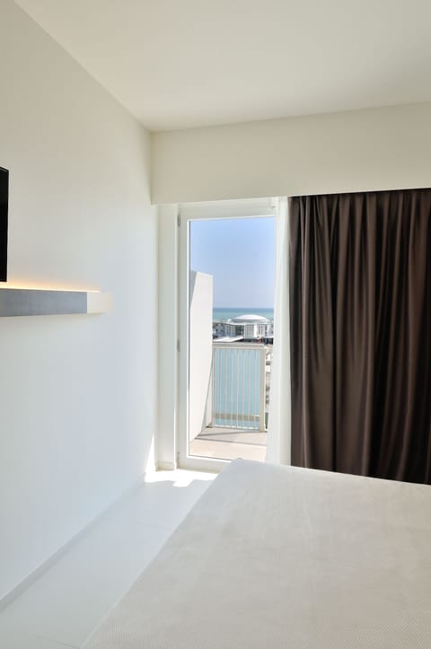 Family Room, 1 Queen Bed, Balcony, Sea View | Minibar, in-room safe, soundproofing, free cribs/infant beds