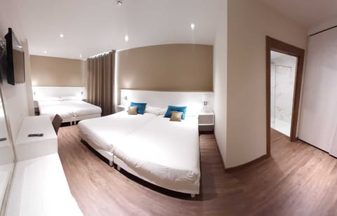 Quadruple Room | Premium bedding, desk, blackout drapes, free cribs/infant beds