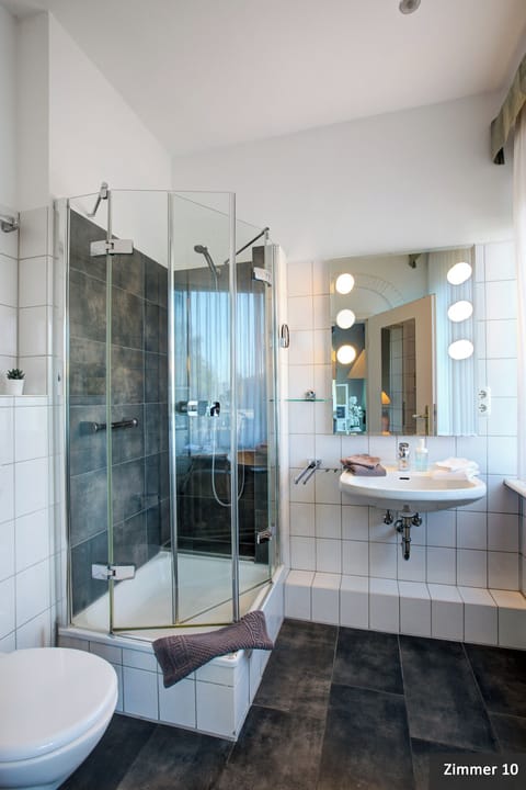Suite, Non Smoking, Balcony | Bathroom | Shower, free toiletries, hair dryer, bathrobes