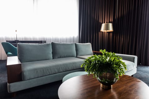 Corner Suite | Living area | 55-inch flat-screen TV with digital channels, TV