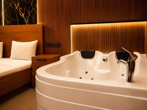 Deluxe Double Room, Jetted Tub | Bathroom | Designer toiletries, hair dryer, slippers, bidet