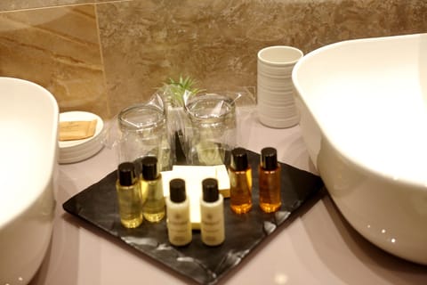 Deluxe Room, 1 Bedroom, SILVER | Bathroom amenities | Free toiletries, hair dryer, bathrobes, slippers