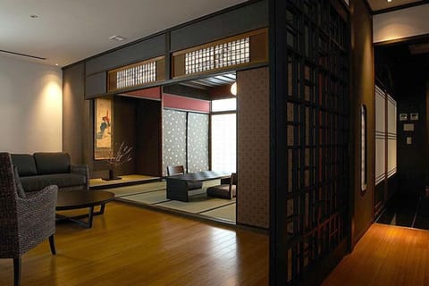 Executive Suite Room | Minibar, in-room safe, individually decorated, individually furnished