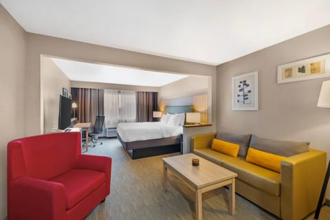 Desk, laptop workspace, blackout drapes, iron/ironing board