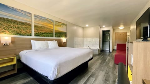 Suite, 1 King Bed, Non Smoking | Desk, iron/ironing board, free WiFi, bed sheets