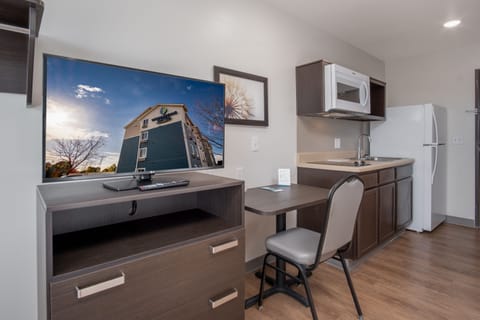 Desk, laptop workspace, blackout drapes, iron/ironing board