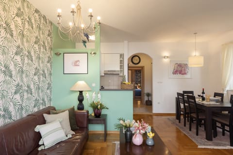 Deluxe Apartment, 2 Bedrooms, Balcony | Living area | Flat-screen TV, DVD player