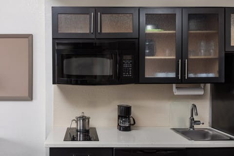 Desk, blackout drapes, iron/ironing board, free cribs/infant beds