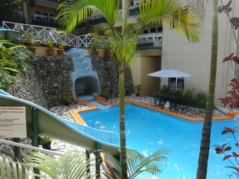 Outdoor pool, open 7:00 AM to 7:00 PM, pool umbrellas, sun loungers