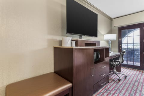 Premium bedding, desk, laptop workspace, iron/ironing board