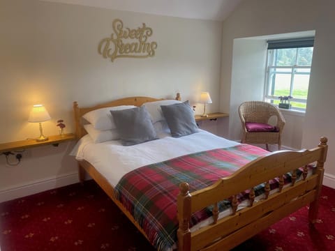 Premium bedding, desk, laptop workspace, blackout drapes