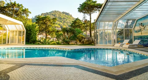 Indoor pool, outdoor pool, open 8:00 AM to 9:00 AM, pool umbrellas