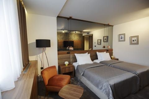 Deluxe Double or Twin Room | Minibar, in-room safe, desk, soundproofing