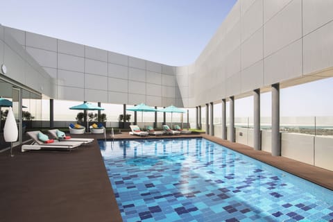 Outdoor pool, open 7:00 AM to 9:00 PM, pool umbrellas, sun loungers