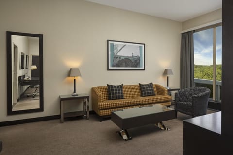 Deluxe Suite | Living area | 37-inch LED TV with cable channels, TV, MP3 dock