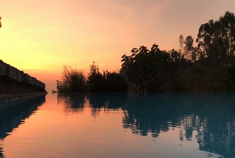 Outdoor pool, an infinity pool, sun loungers