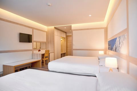 Premium bedding, desk, laptop workspace, free WiFi