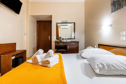 Double or Twin Room | Minibar, desk, blackout drapes, iron/ironing board