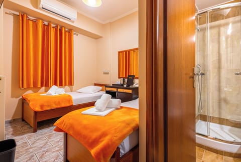 Double or Twin Room | Minibar, desk, blackout drapes, iron/ironing board